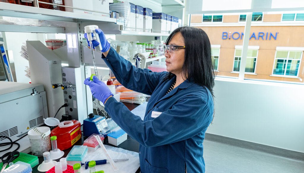 BioMarin scientist pipetting in a lab